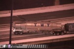 Tractor-trailer slides on icy Interstate bridge